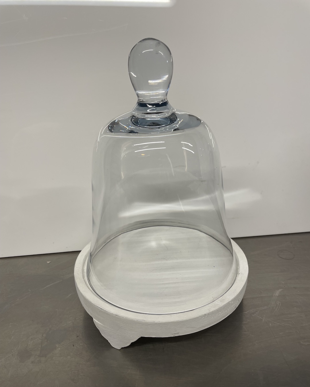 Glass cloche with white base