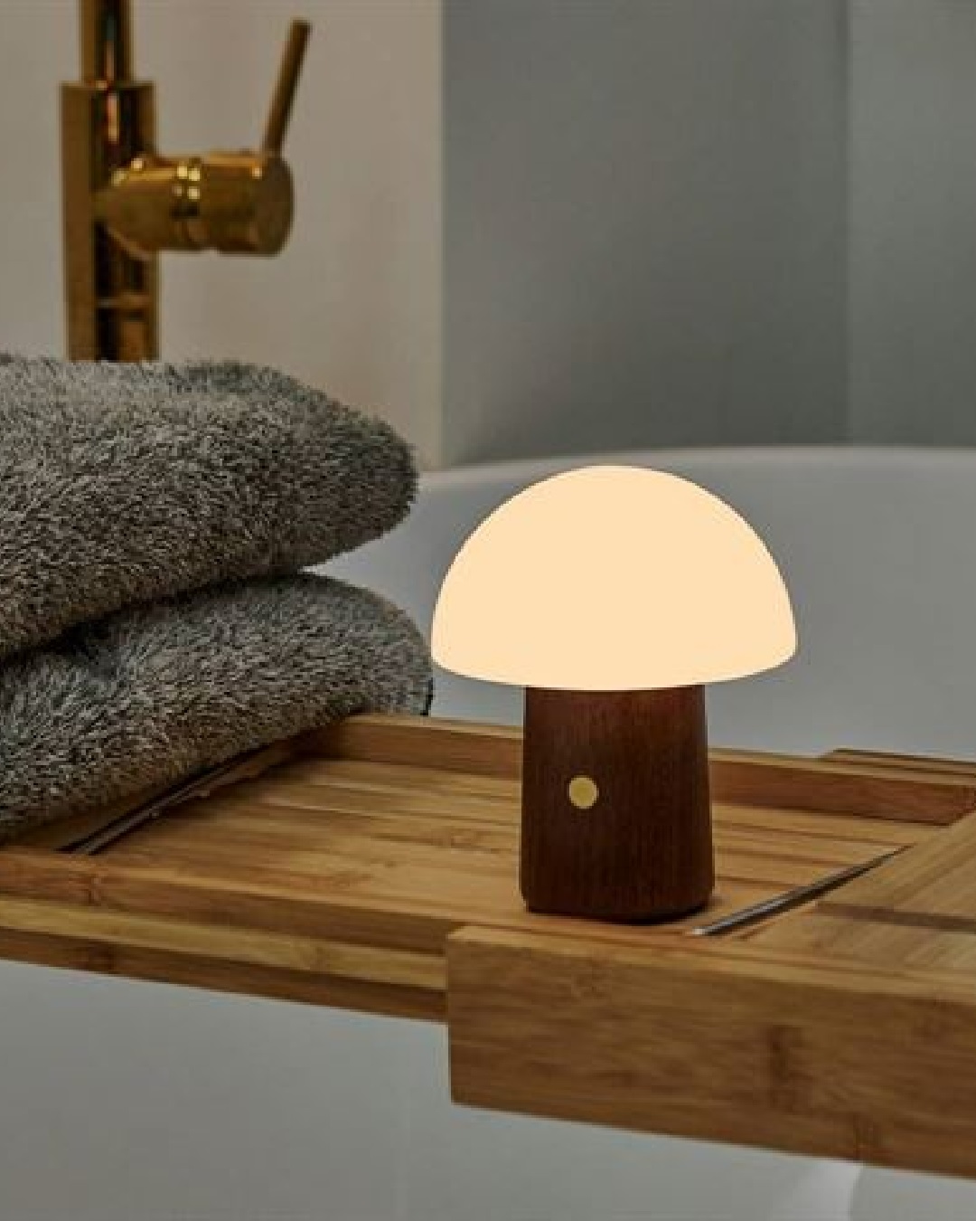 Mushroom lamp on wooden bath tray