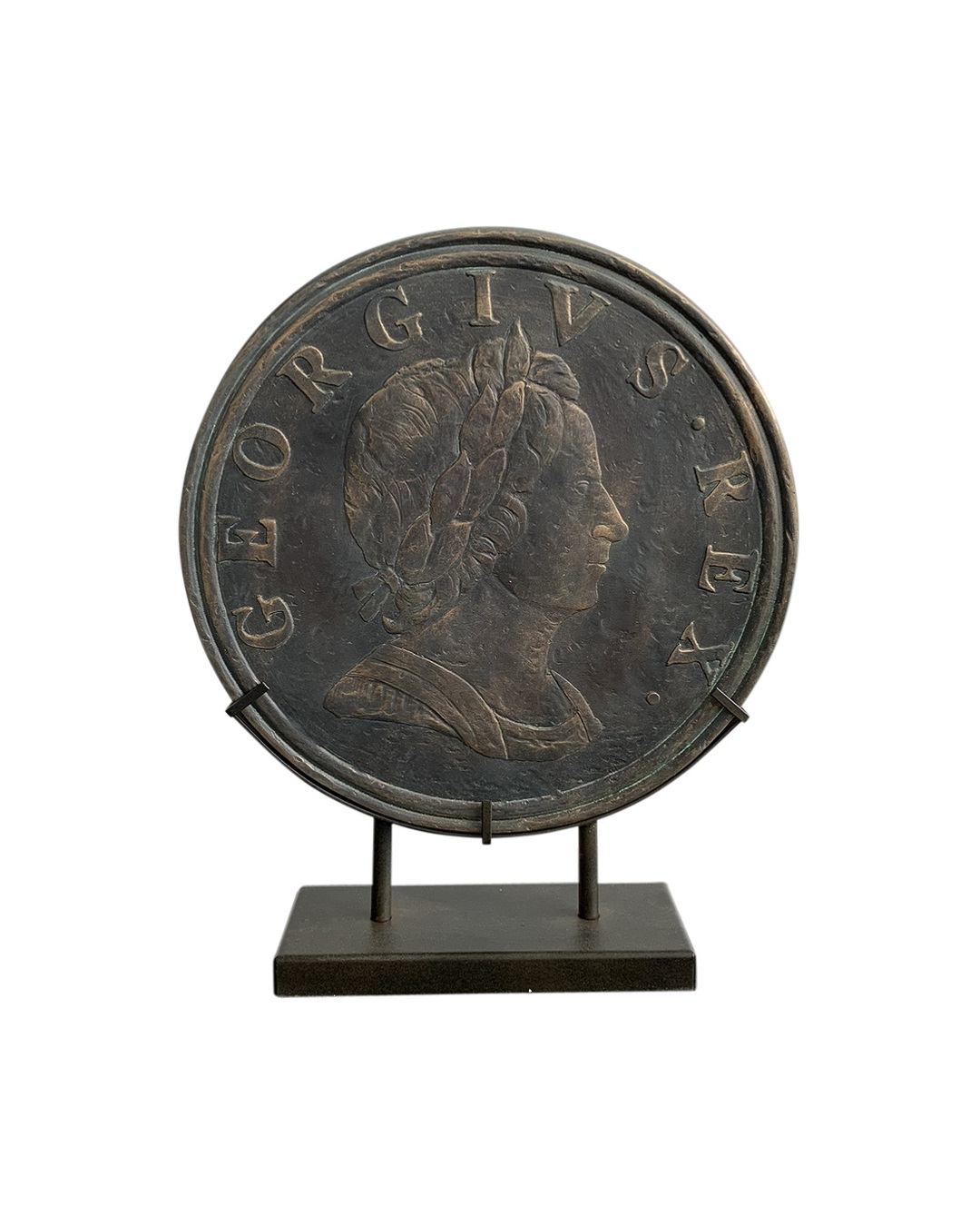 Antique old coin on stand