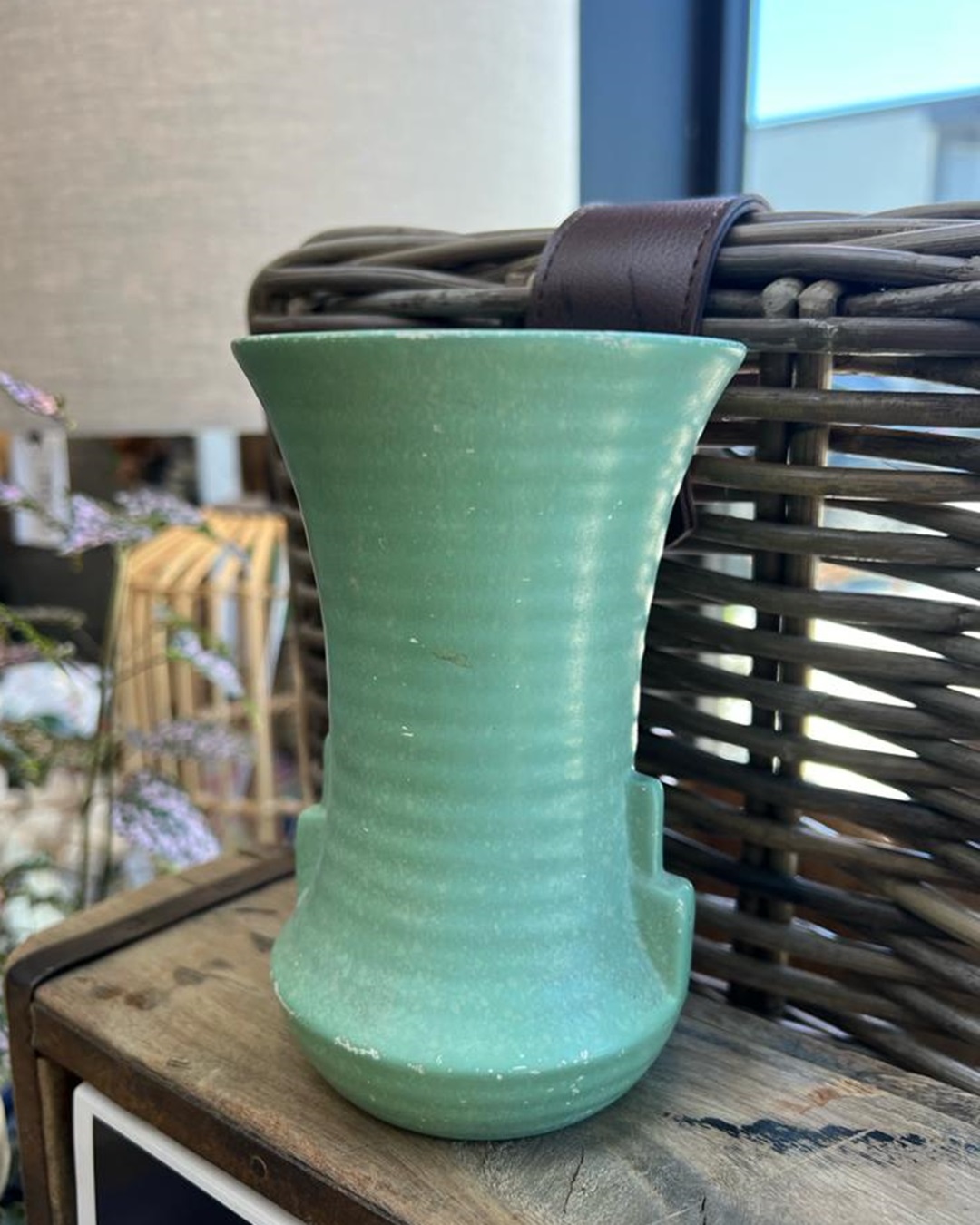 Art deco green vase on shelf