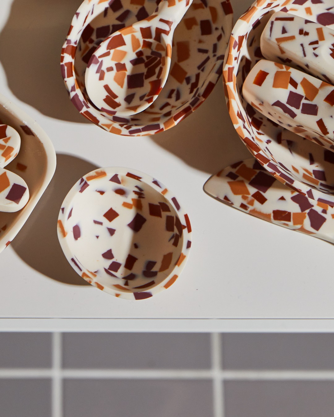 Terrazzo red and orange bowls on a table