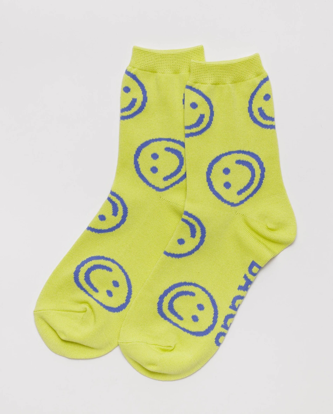 Yellow with blue smiley faces pair of socks