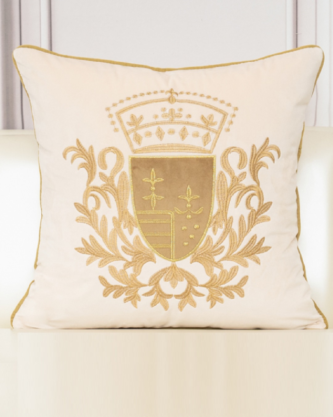 Beige and gold embroidered cushion