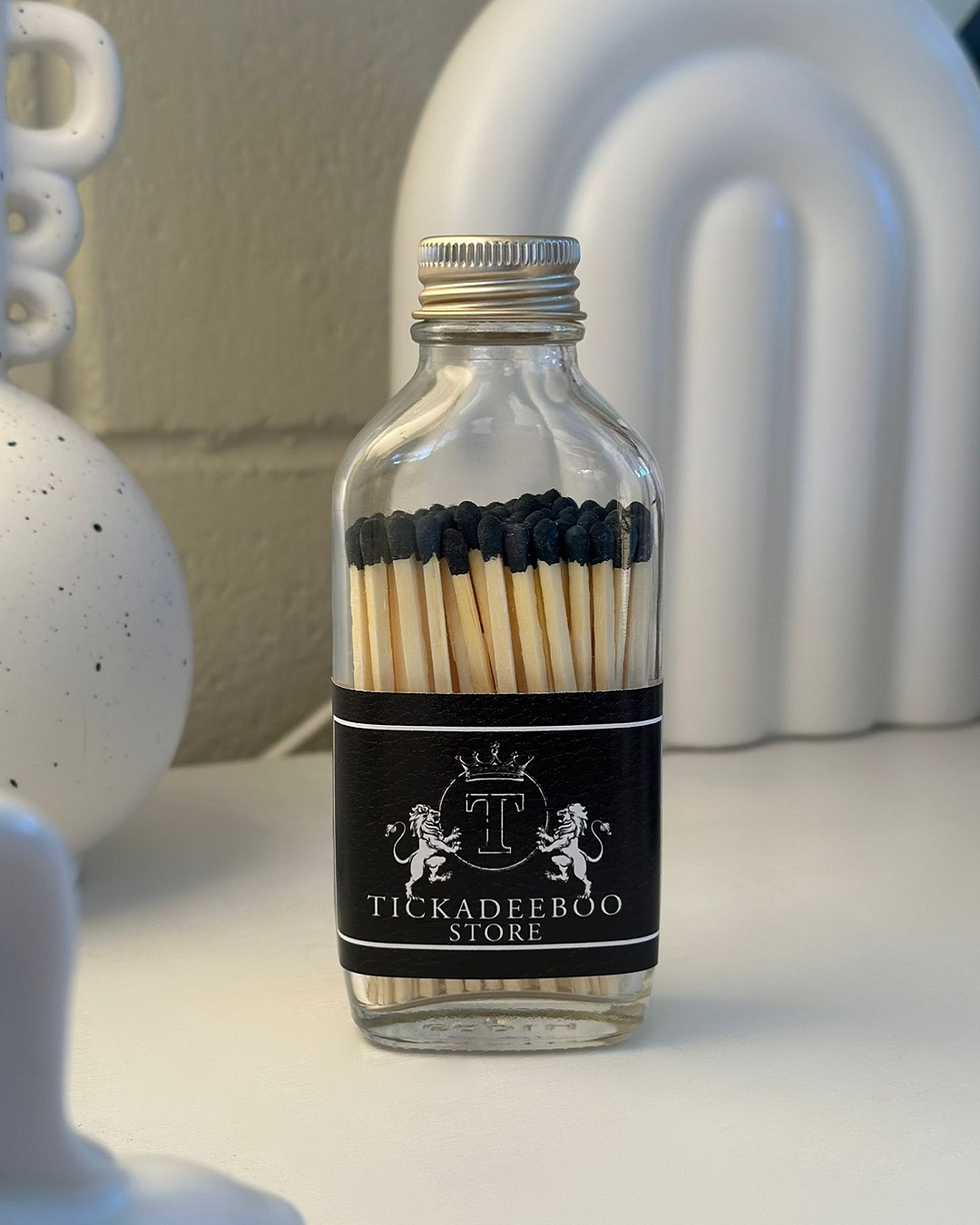 Black matches in a bottle with Tickadeeboo label
