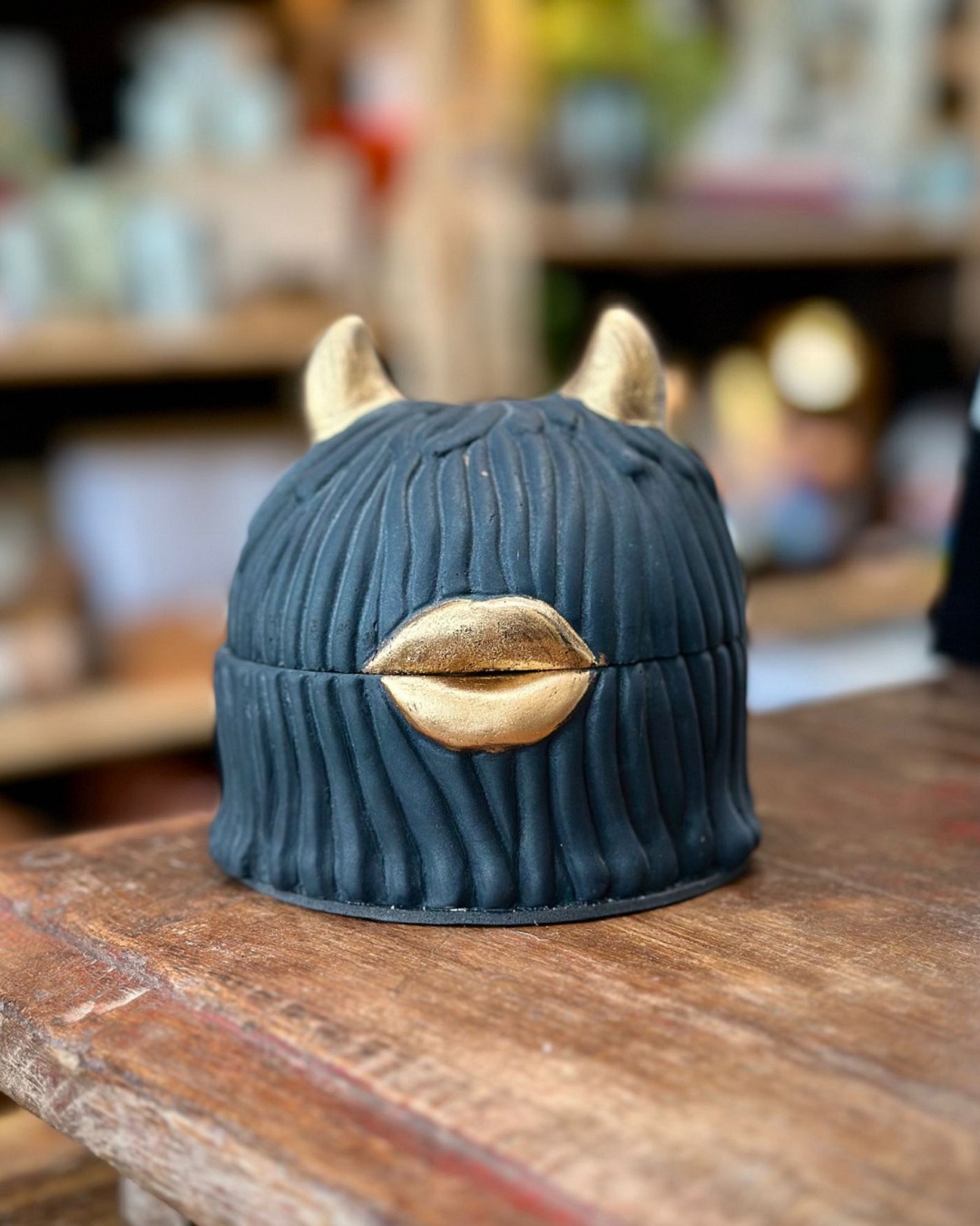 Black Yak ashtray on table