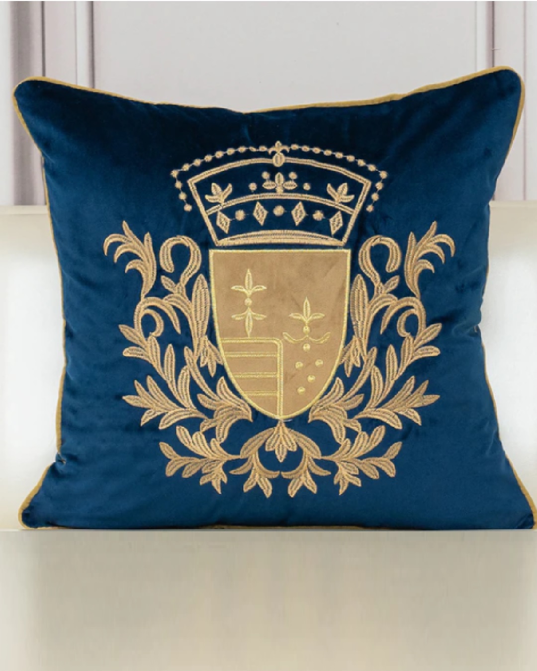 Blue and gold embroidered cushion