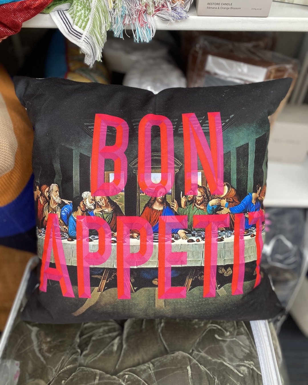 Cushion with Bon Appetit in pink bold writing