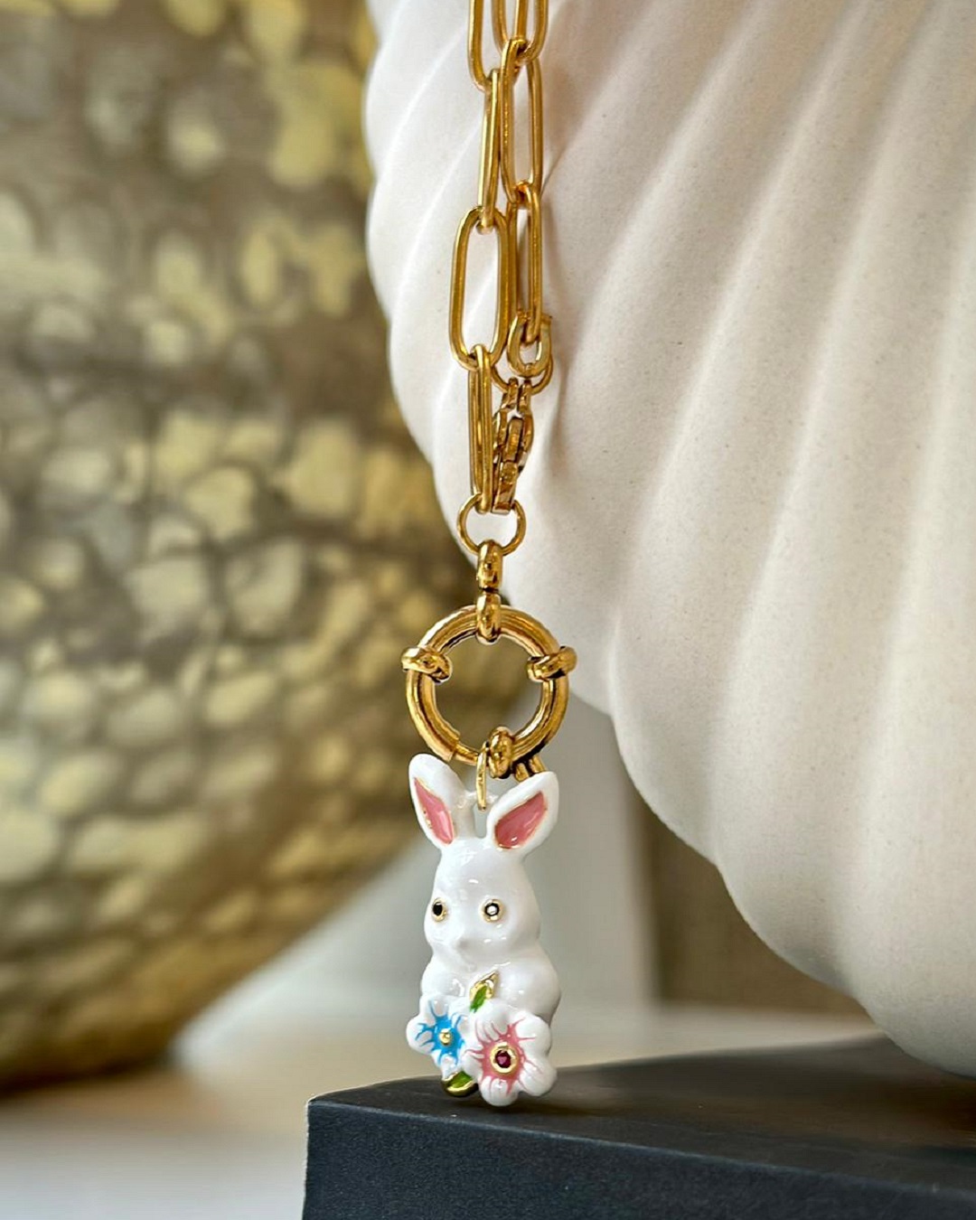 White rabbit necklace on a gold plated chain