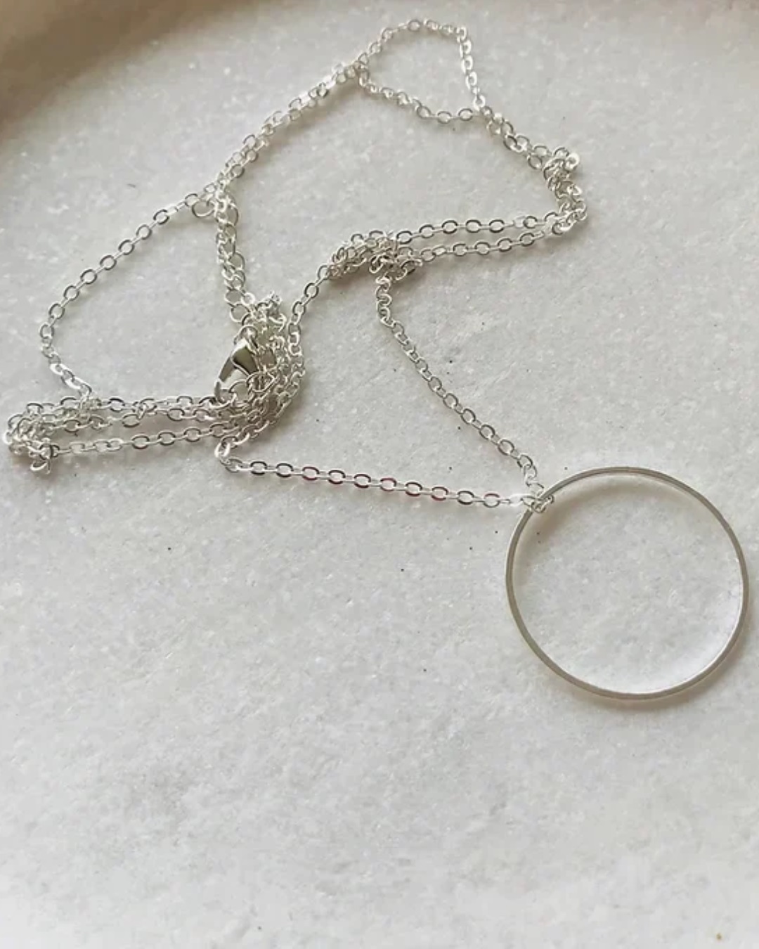 Silver circle necklaces on chain