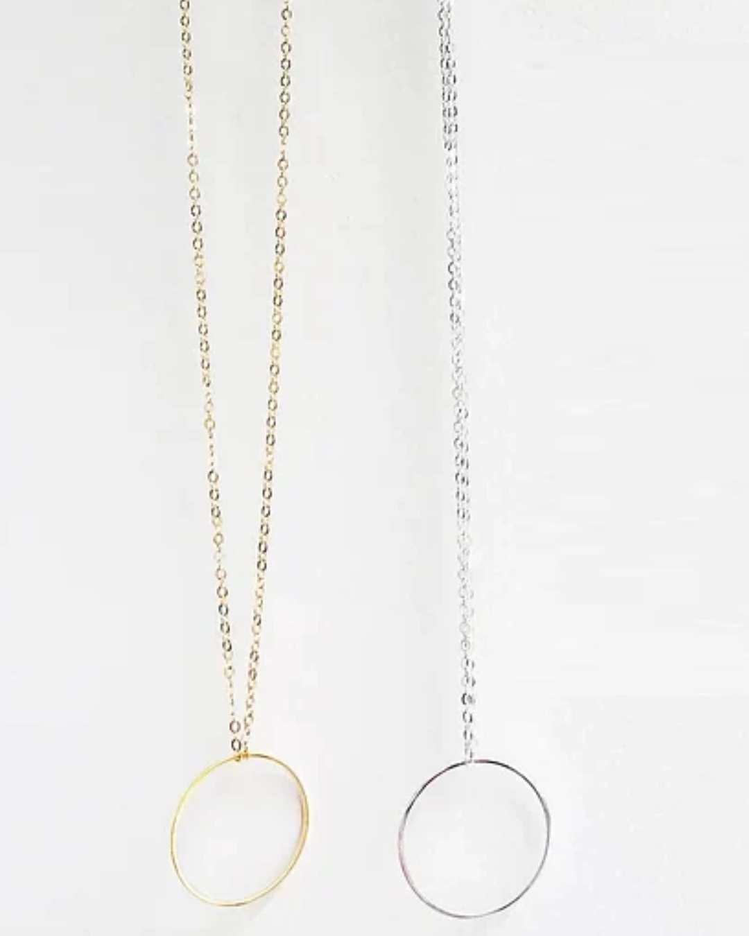 Silver and gold circle necklaces on chain