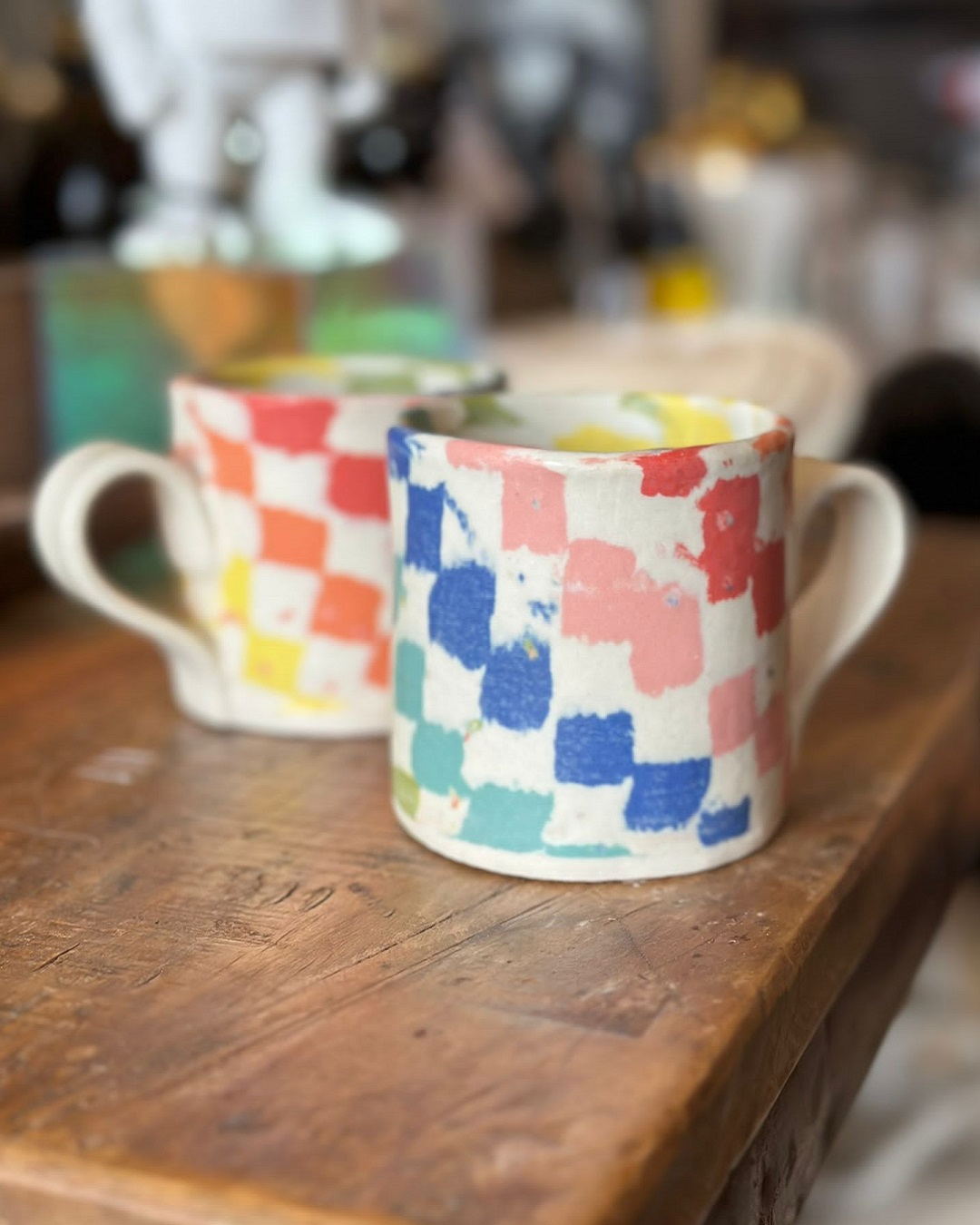 Checked rainbow mugs