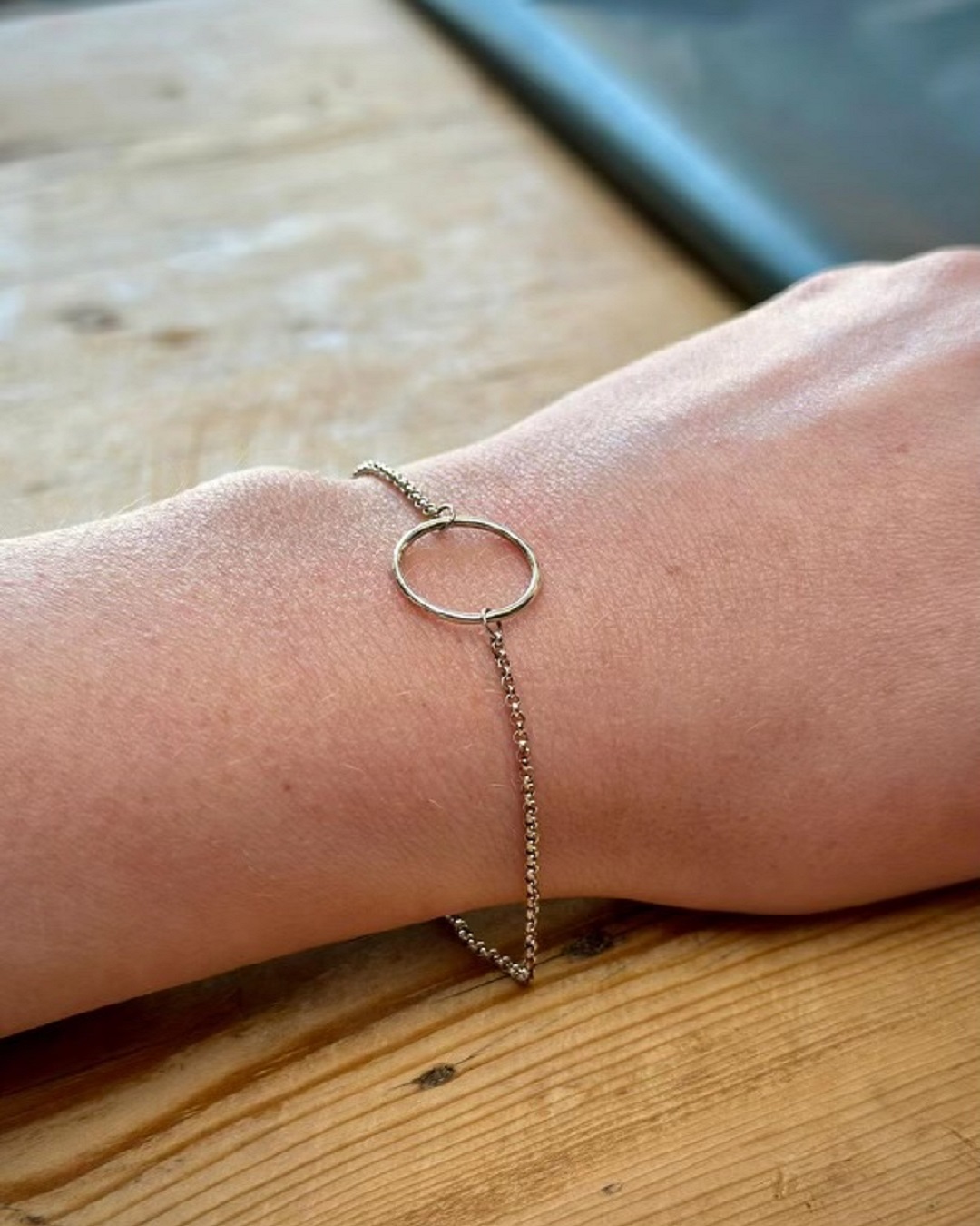 thin bracelet with circle on wrist