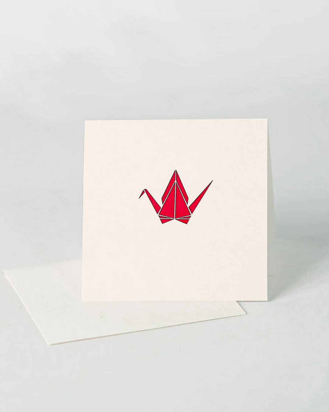 Cream square card with red crane on it and envelope