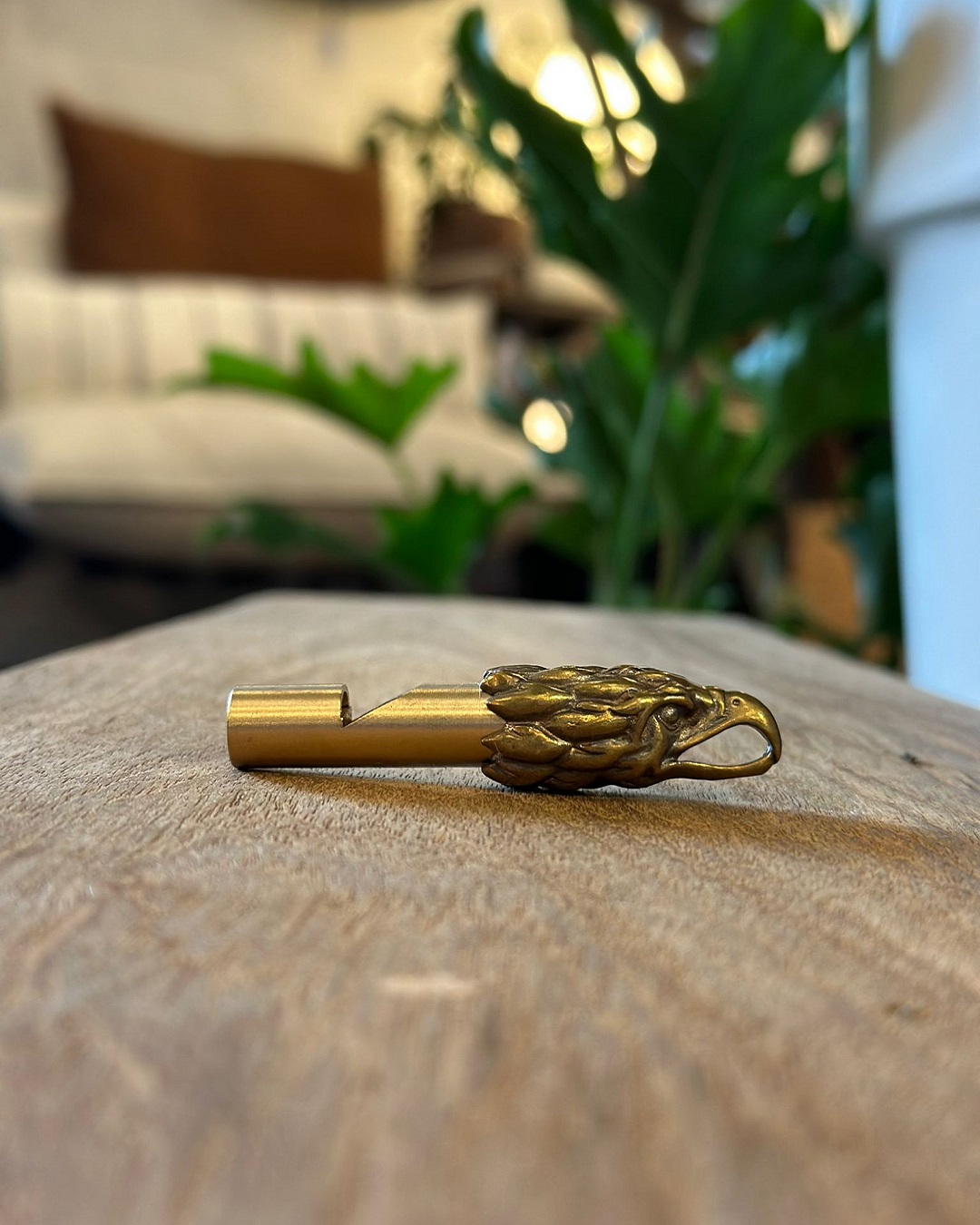 Gold eagle keyring on a table