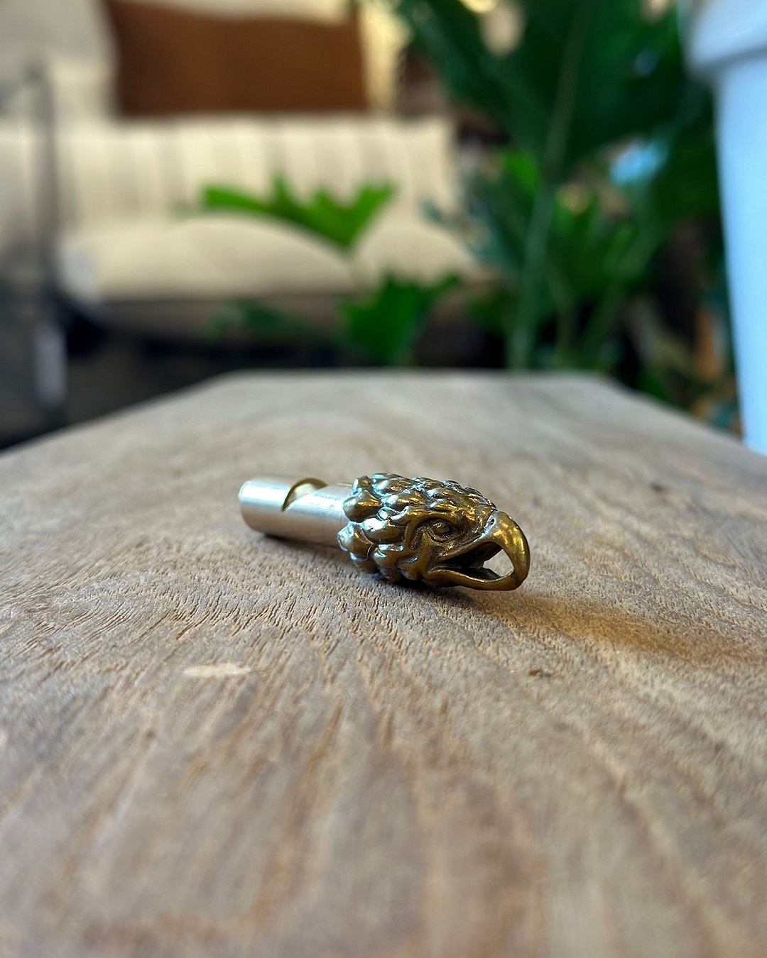 Gold eagle keyring on a table