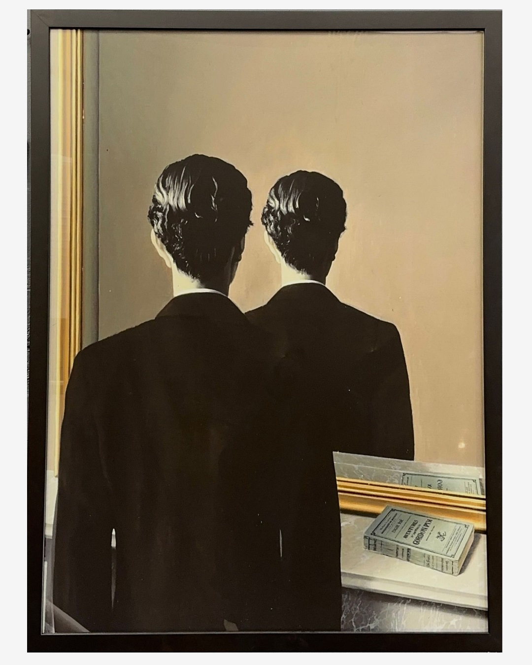 Framed canvas print of man looking in the mirror