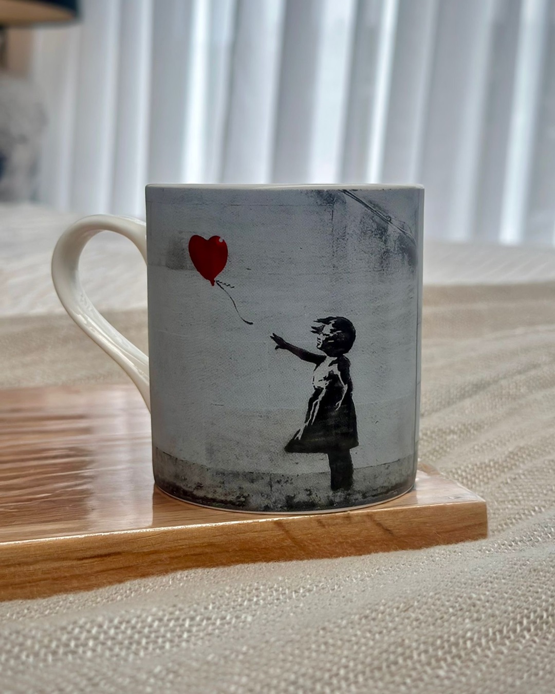 Mug with image of little girl and balloon floating away