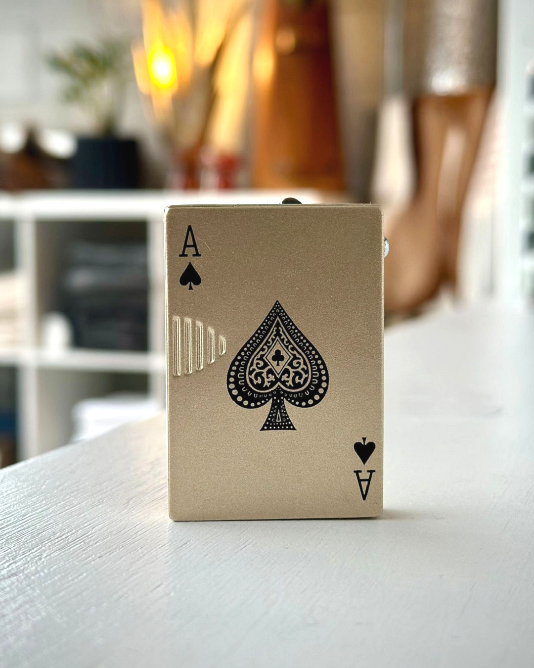 White Ace of cards lighter on table