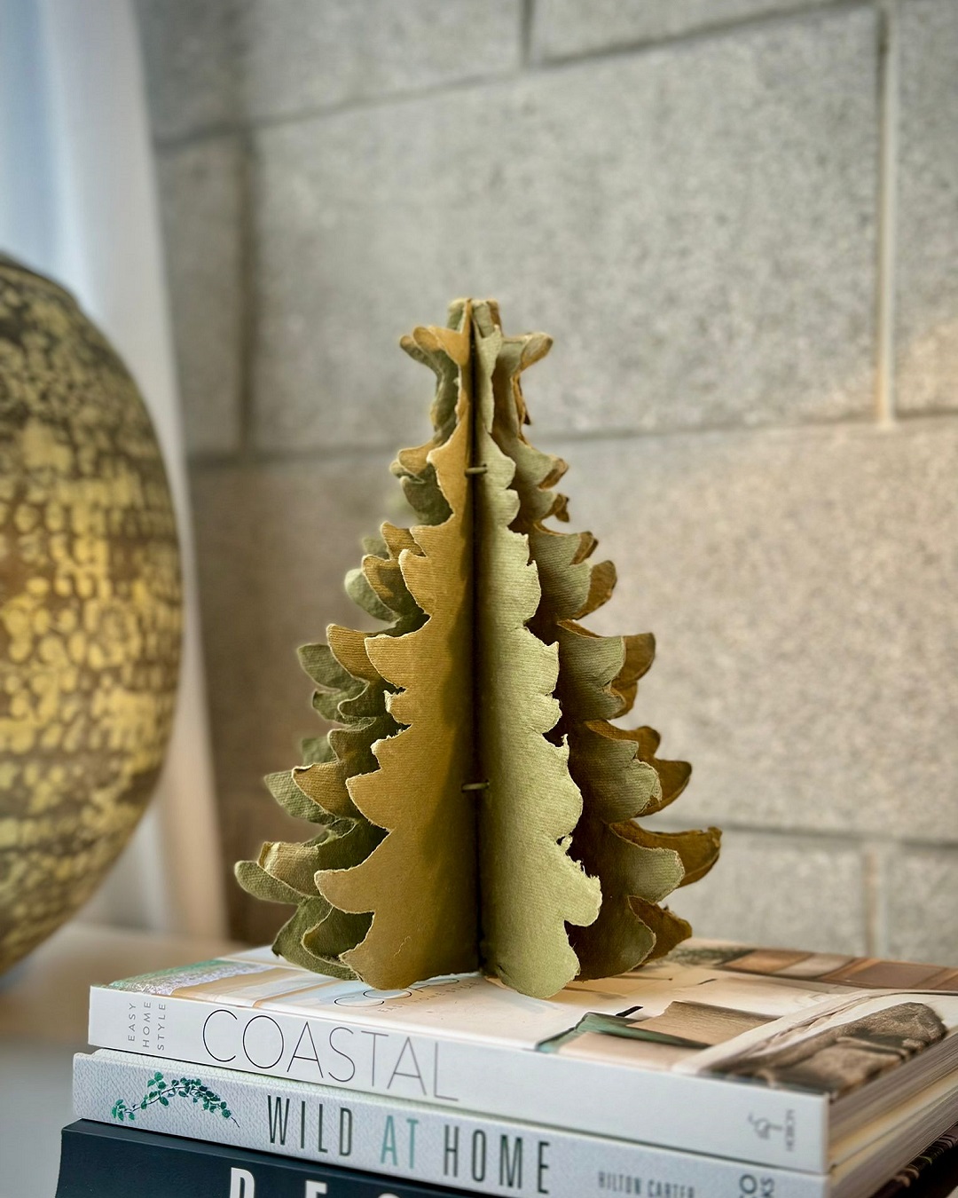 Gold paper fold out Christmas tree on book