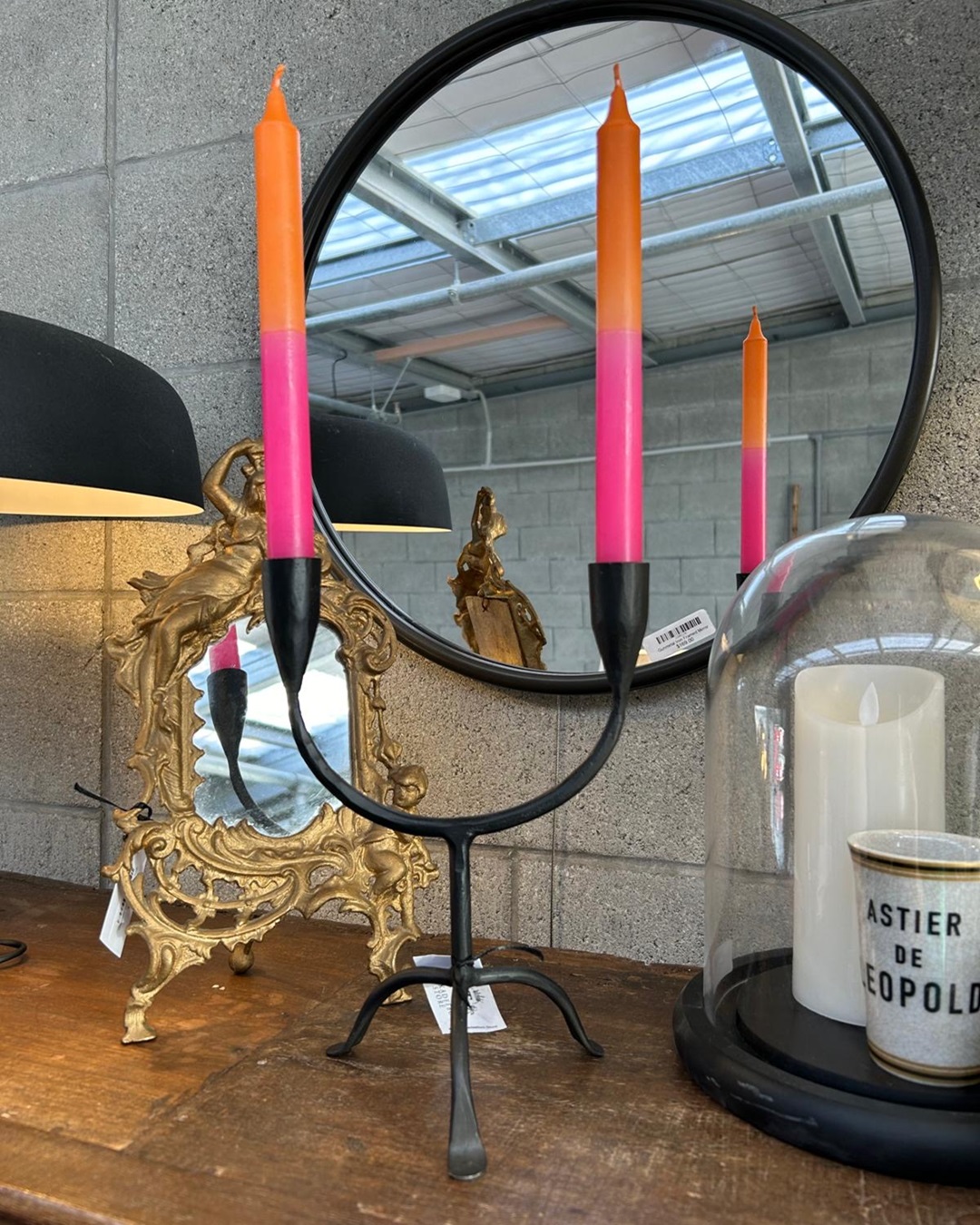 Pink and orange taper candles in candlebra