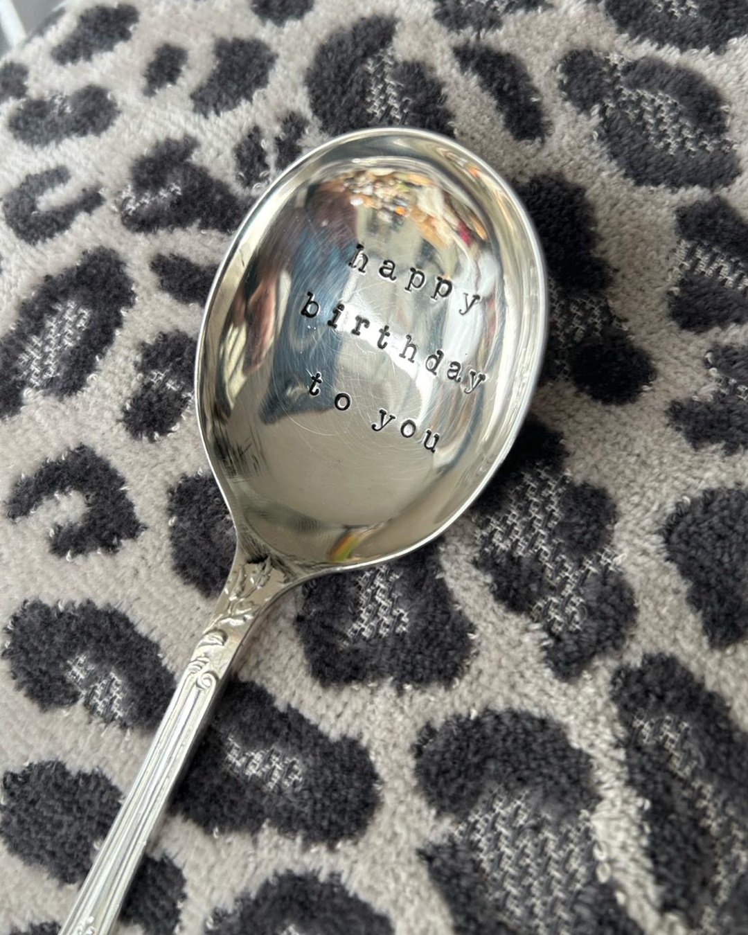 Silver spoon with happy birthday to you stamped