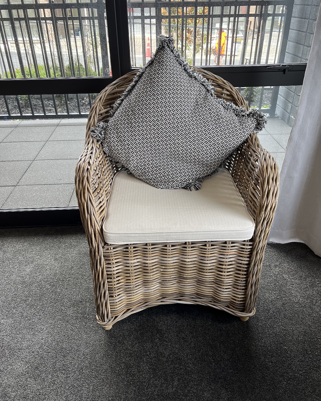 2 cane wicker indoor chairs and padded cushions