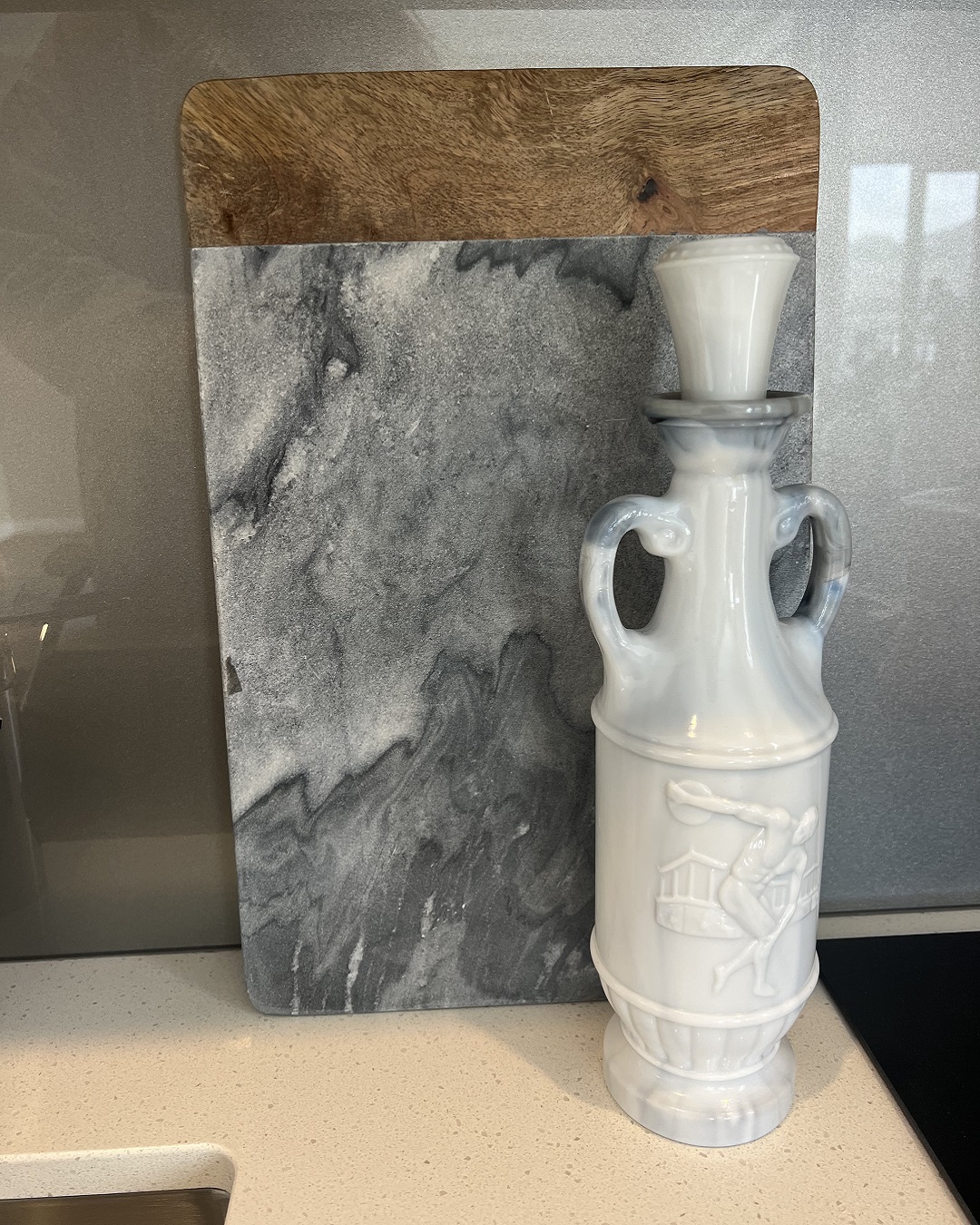 Marble and wood board and old decanter