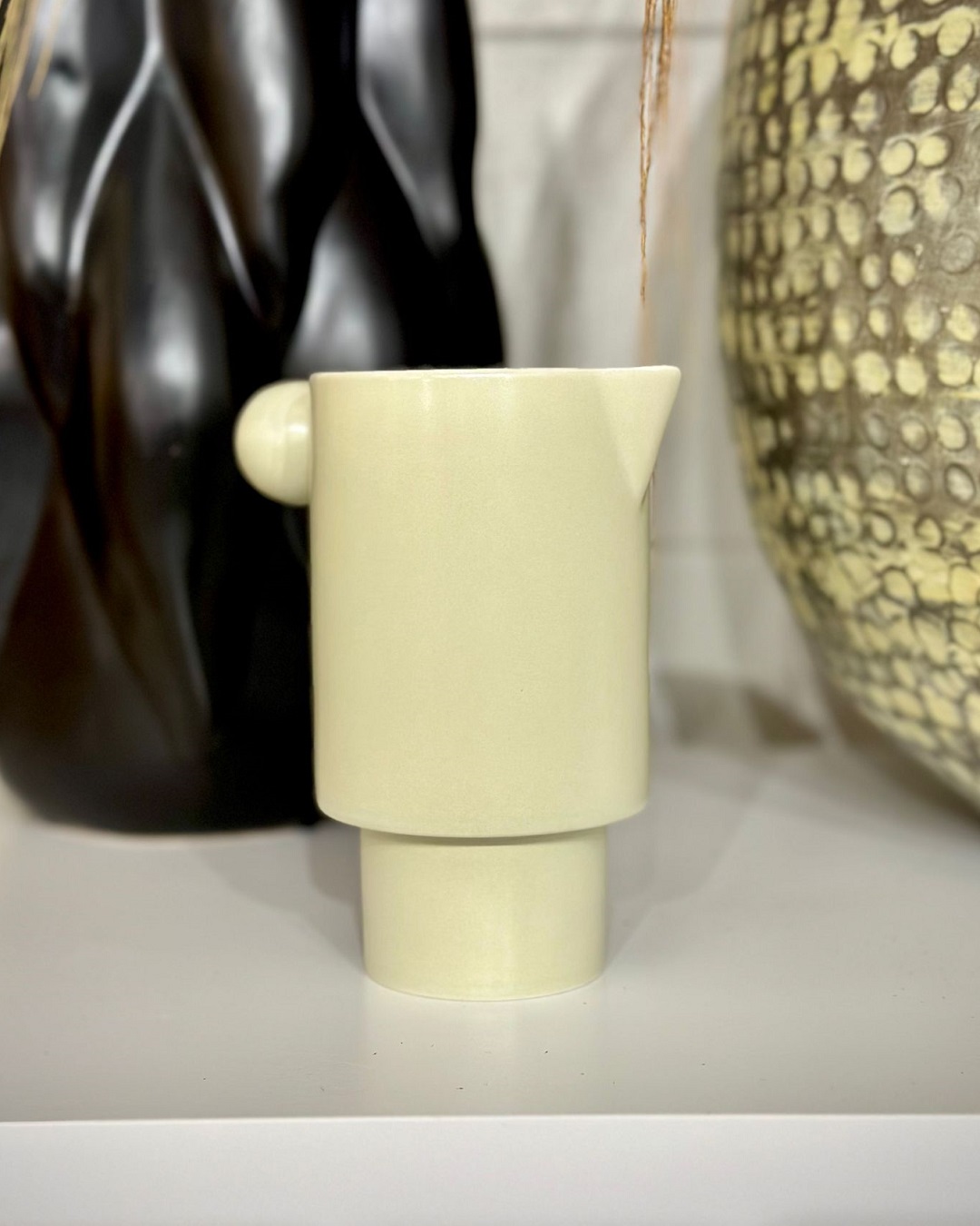 Cream jug on shelf