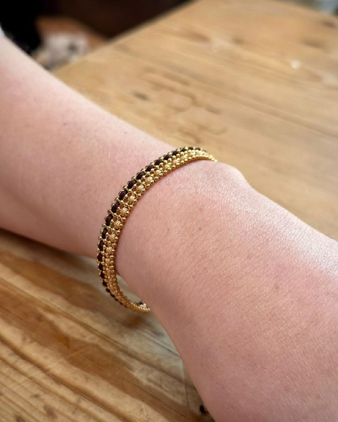 knitted brown gold and beige bracelet on wrist