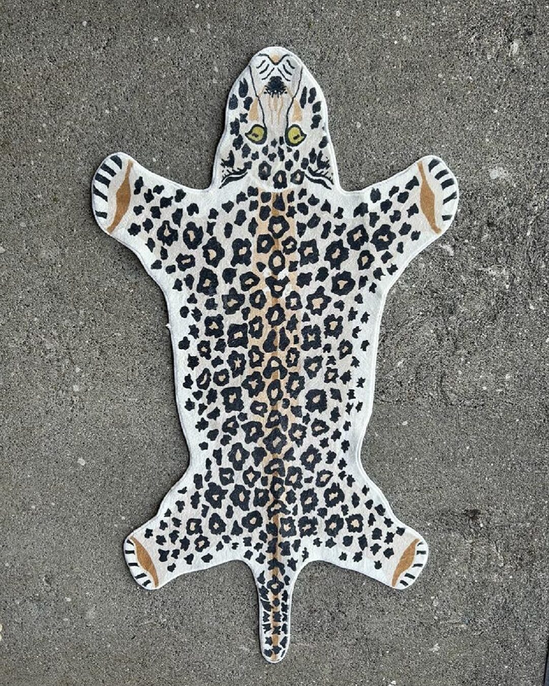 Leopard rug on concrete