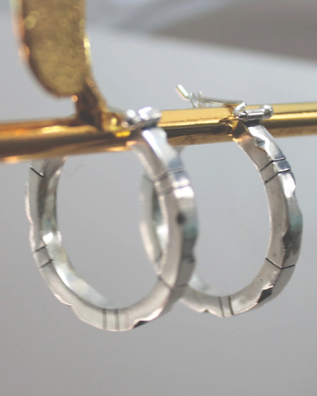 Lined and dented hoop sleeper silver earrings