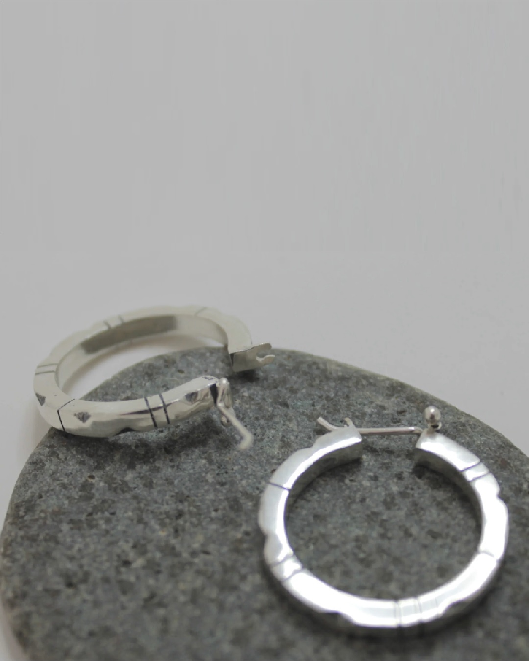 Lined and dented hoop sleeper silver earrings