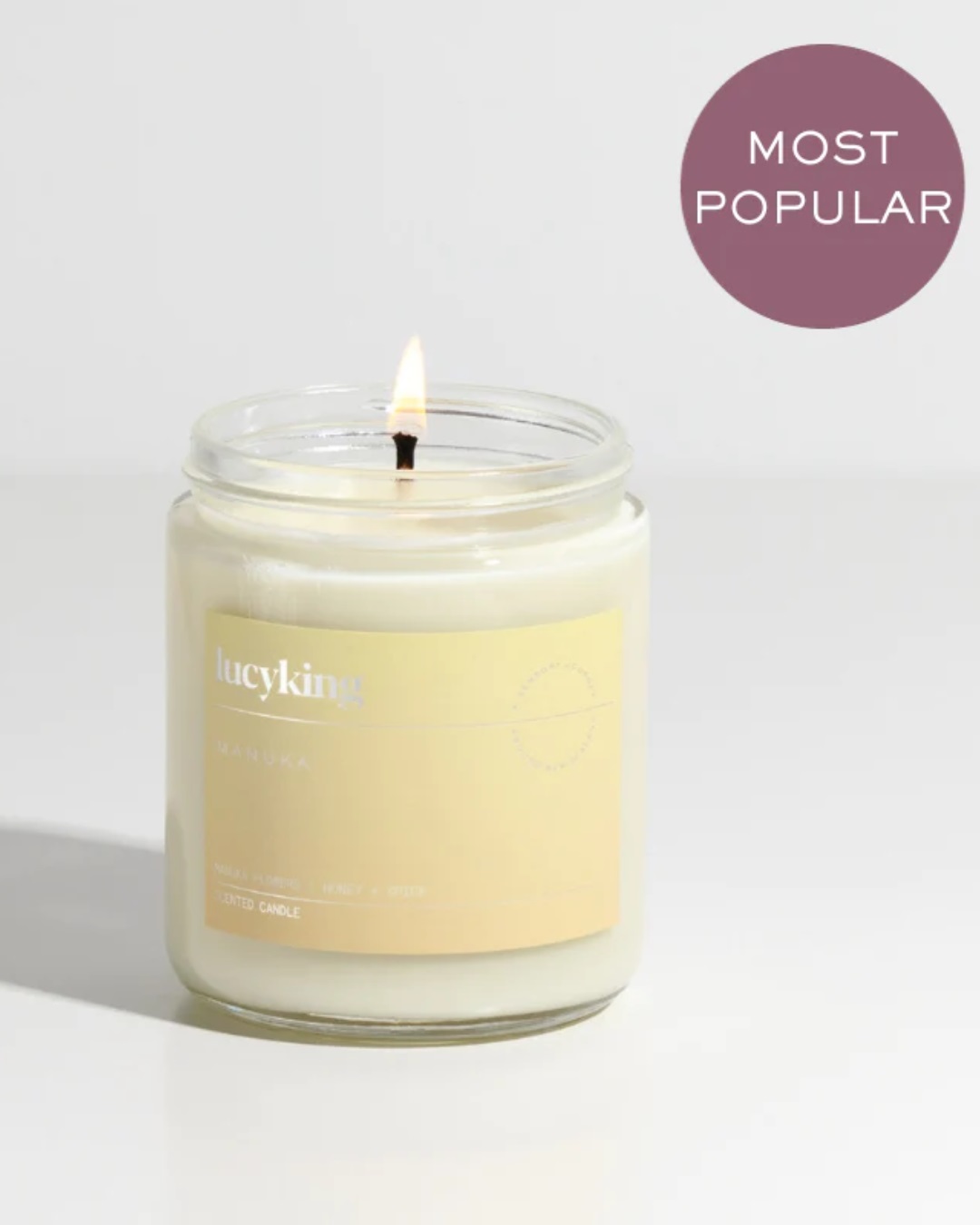 Glass jar candle with yellow label