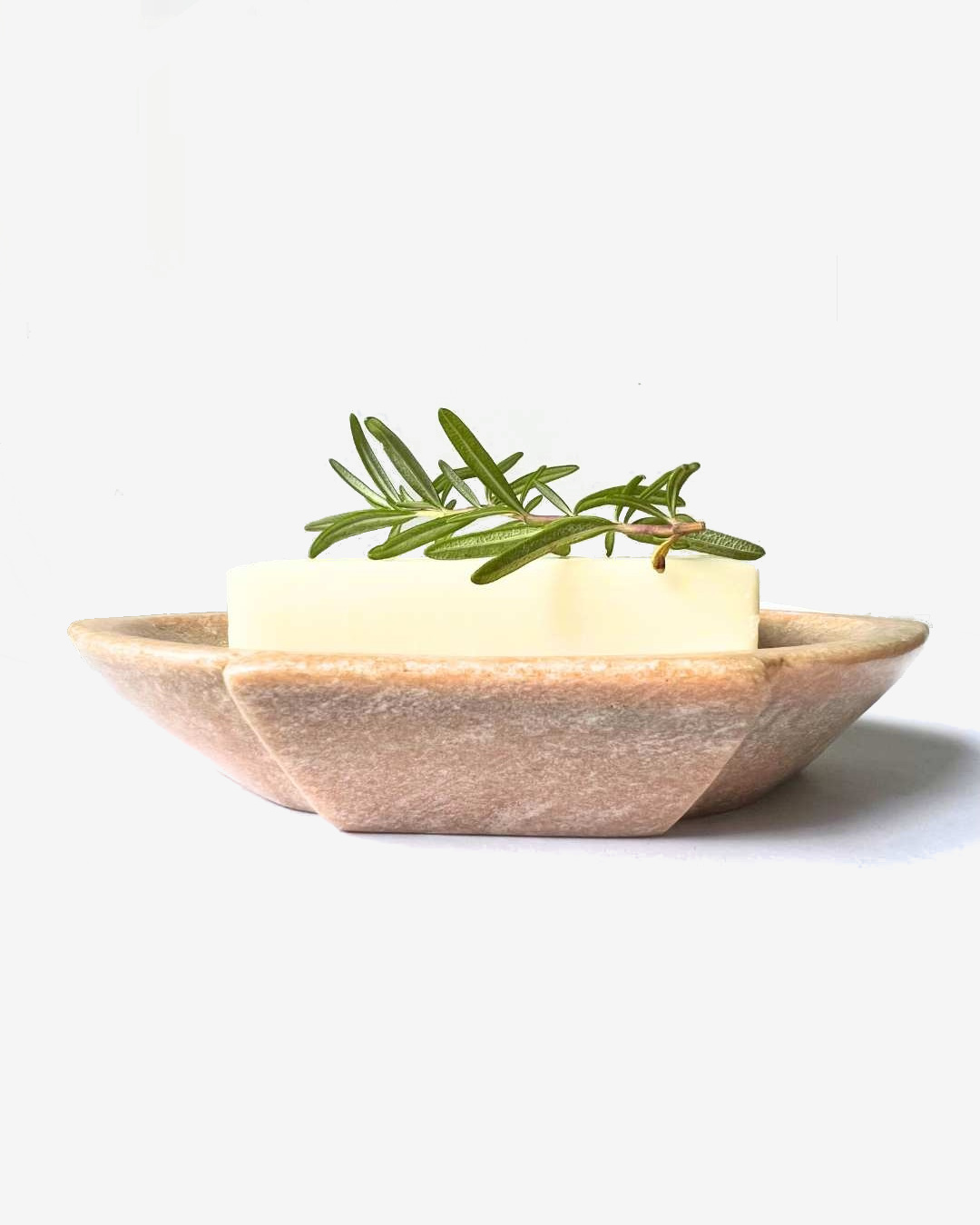 Sand coloured marble soap dish with soap and leaf