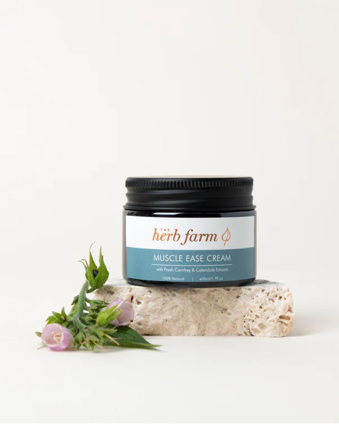 Jar of cream and flower