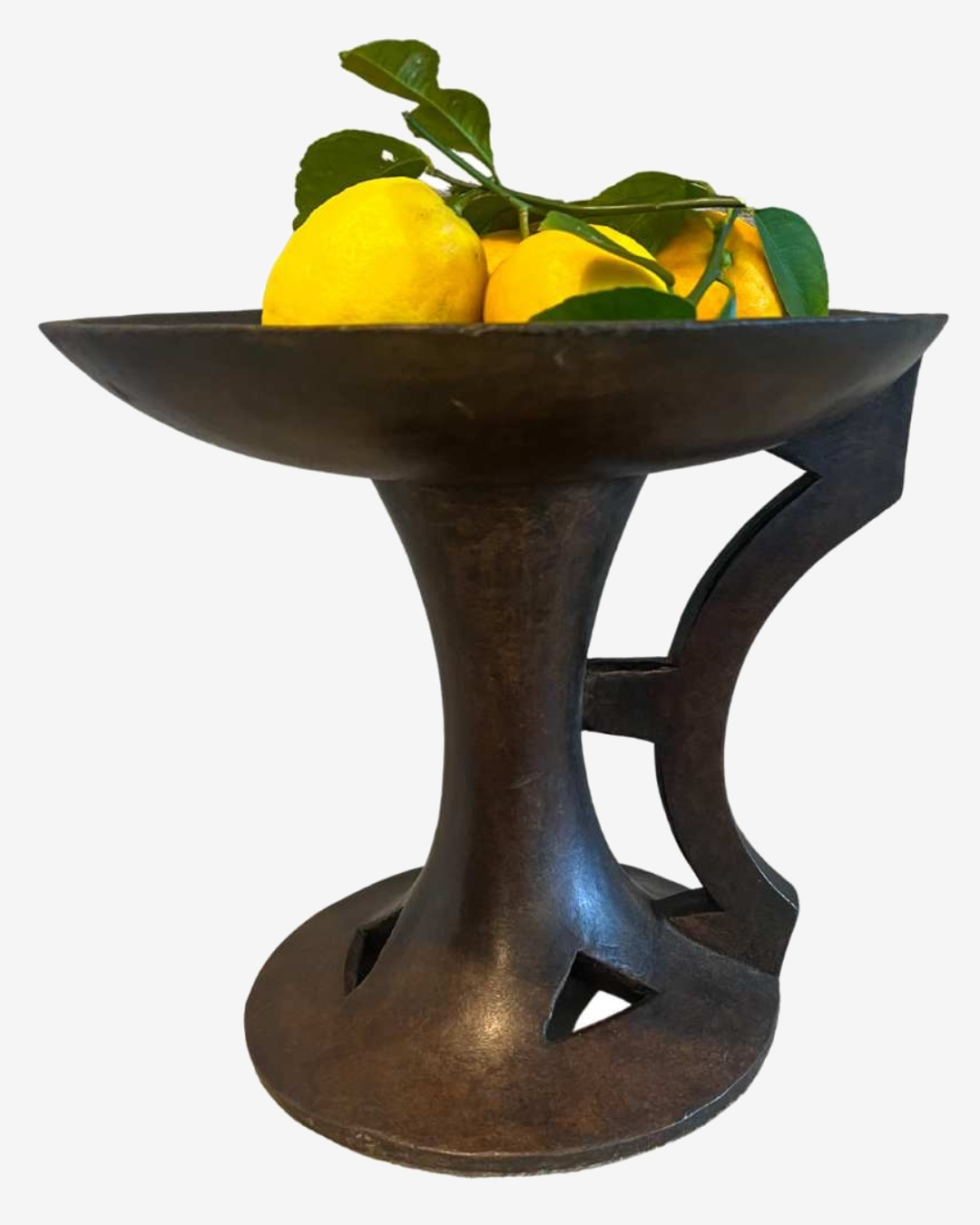 Wooden Indian dish with lemons in it