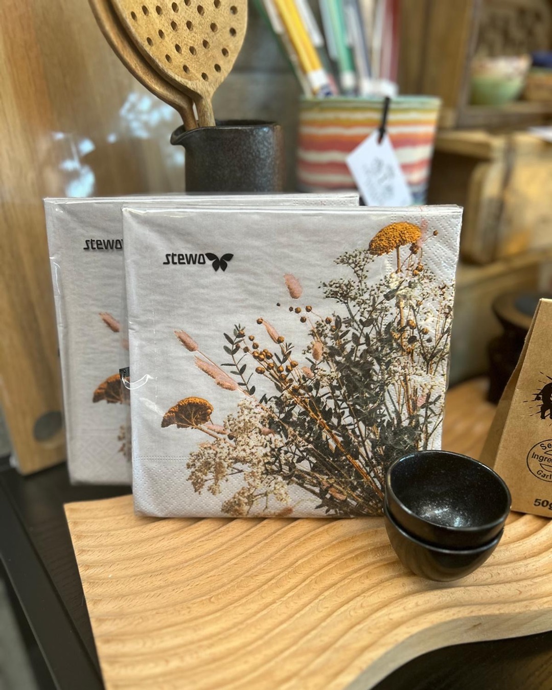 Beige napkins with florals on in a packet