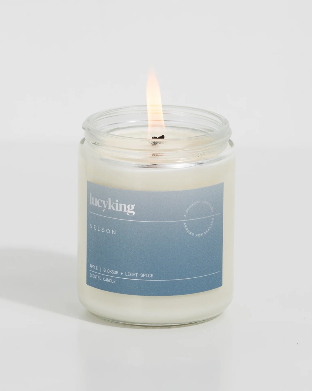 Glass jar candle with blue label