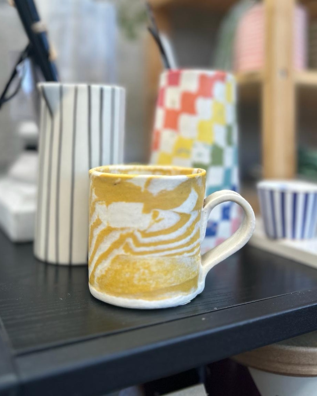 Nerikomi mustard mug on table