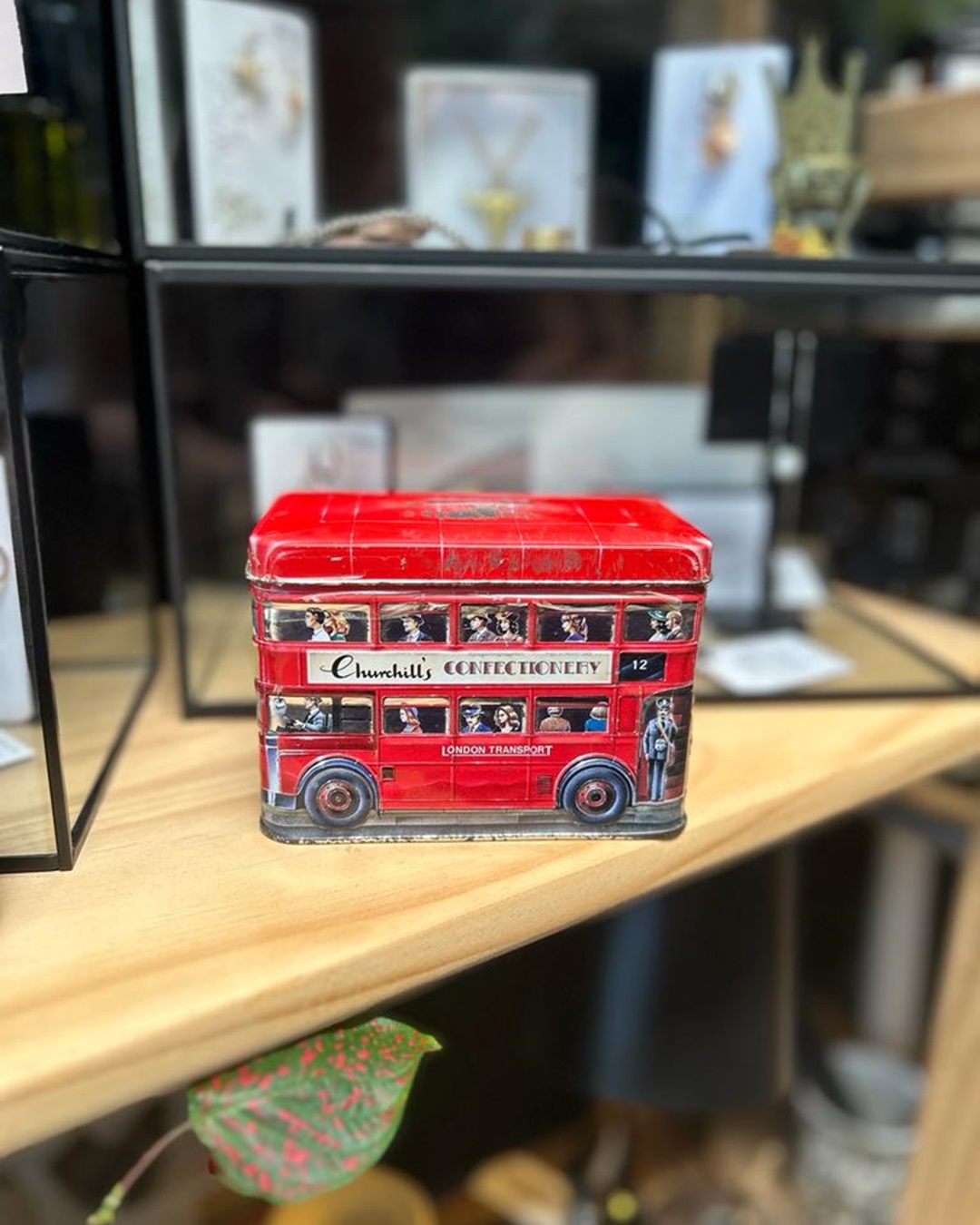 Churchill double decker bus money box on shelf