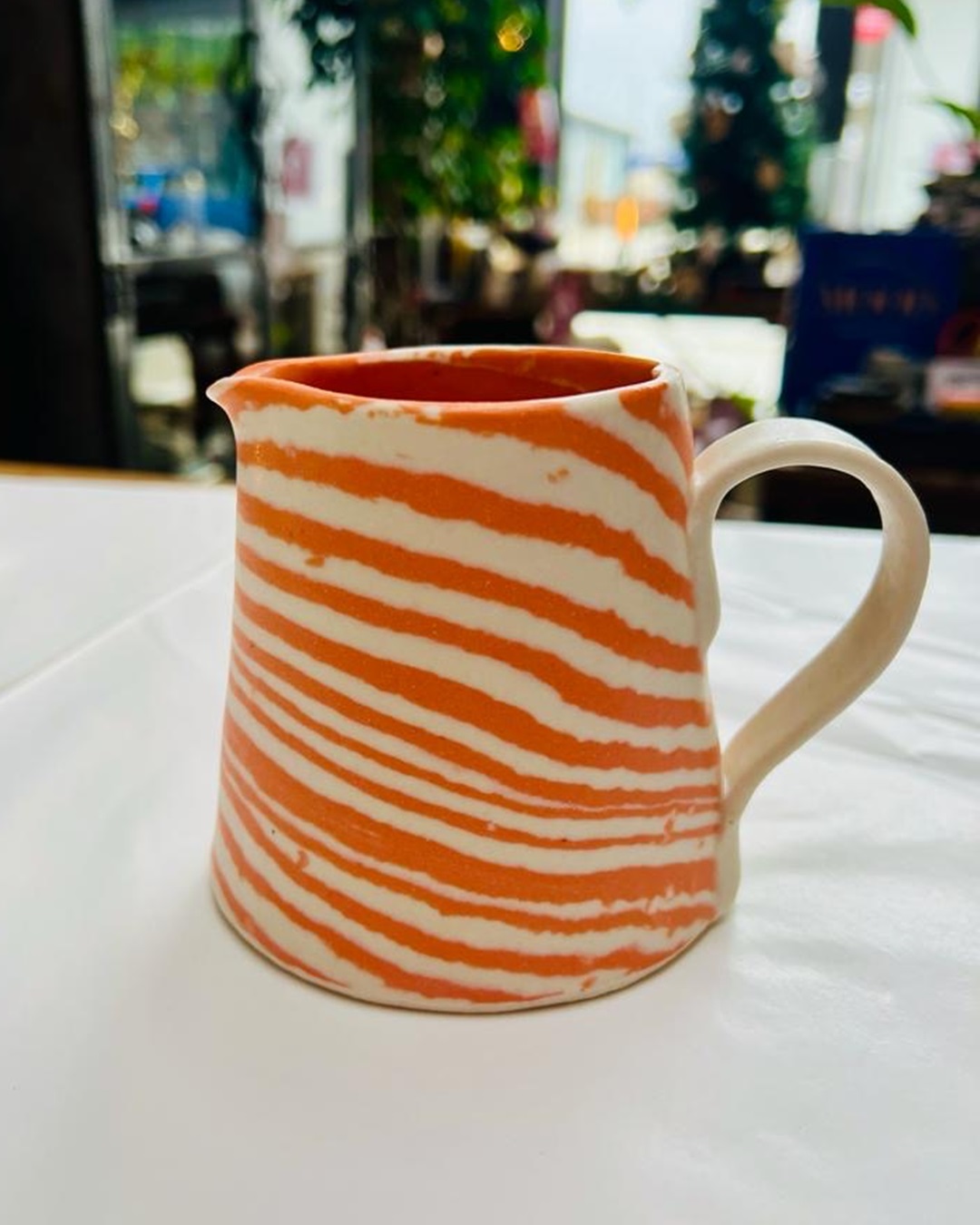 Orange striped nerikomi ceramic jug