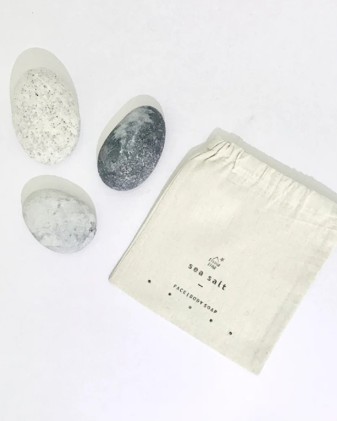Pebble sea salt soap next to bag