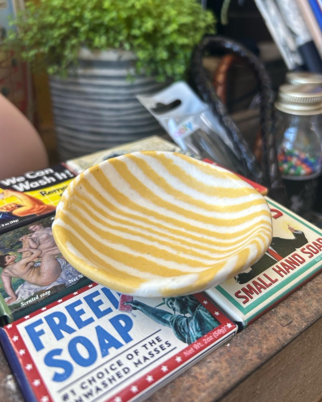 Yellow striped dish on soap