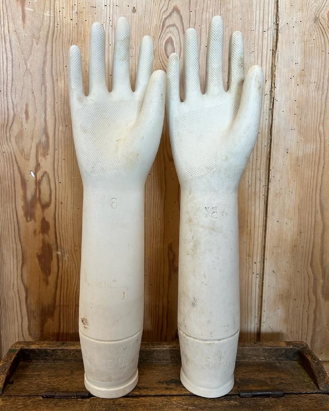 White porcelain glove moulds on a table