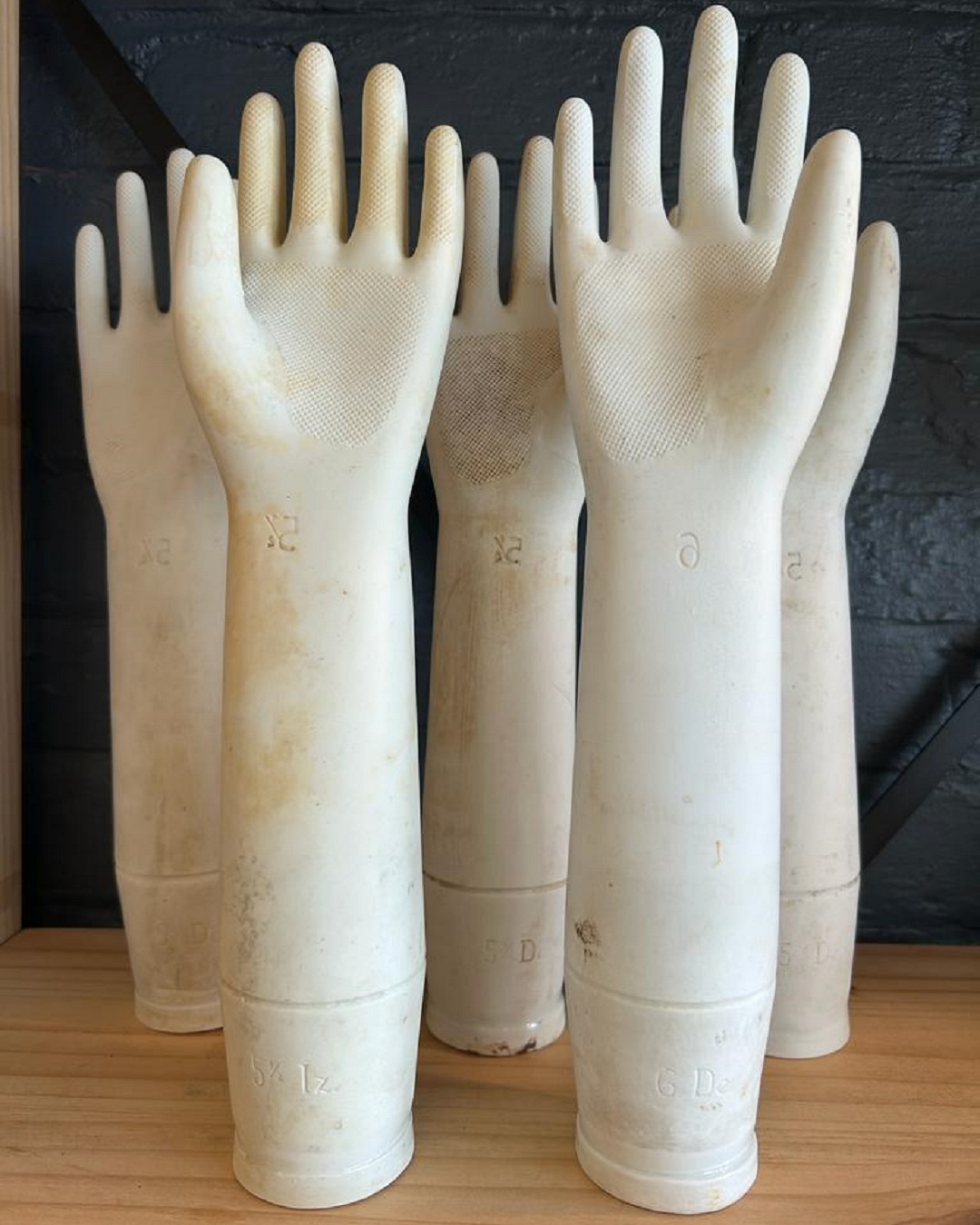 White porcelain glove moulds on a table