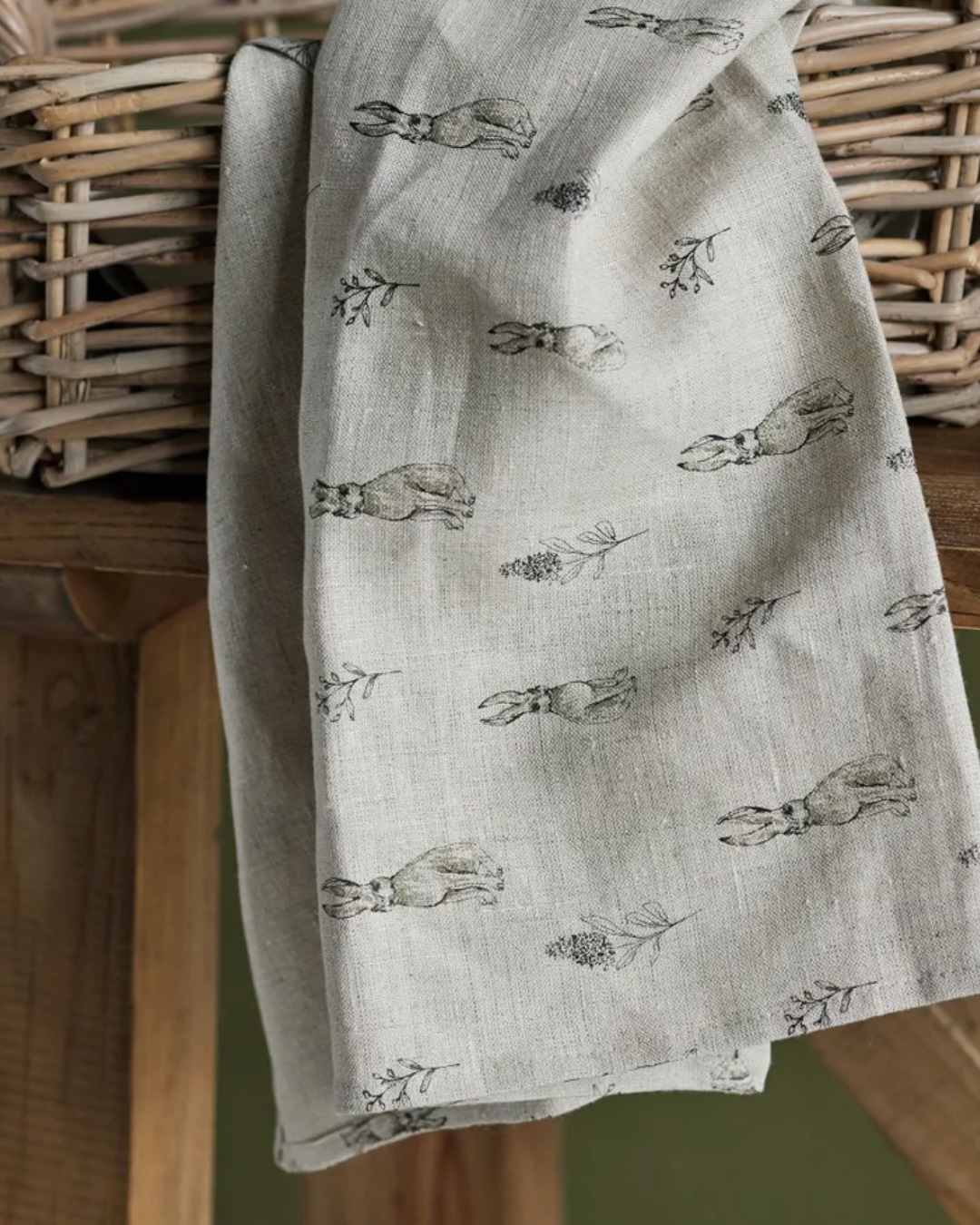 Rabbit grey tea towel hanging on basket