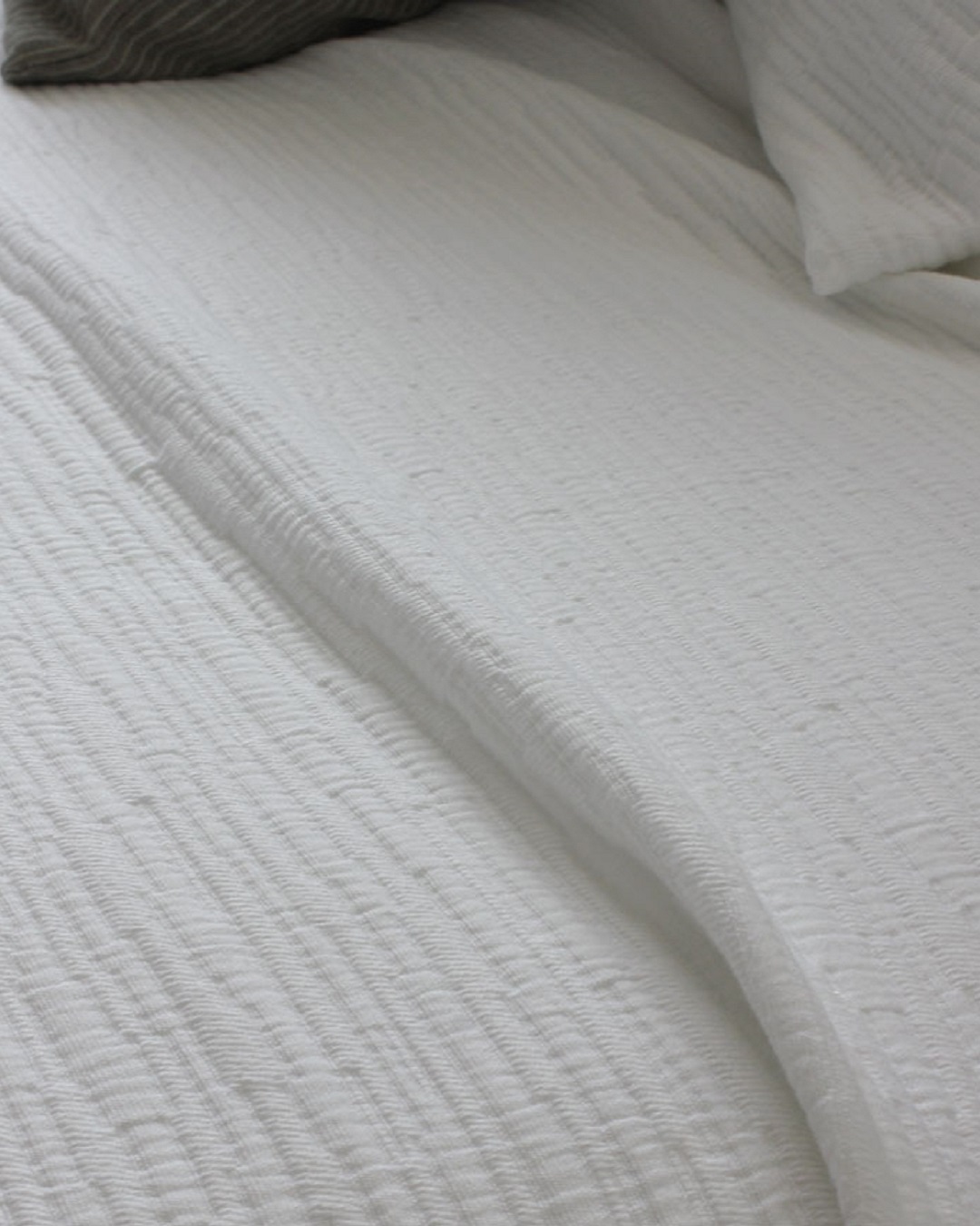 Ripple optical white bedspread