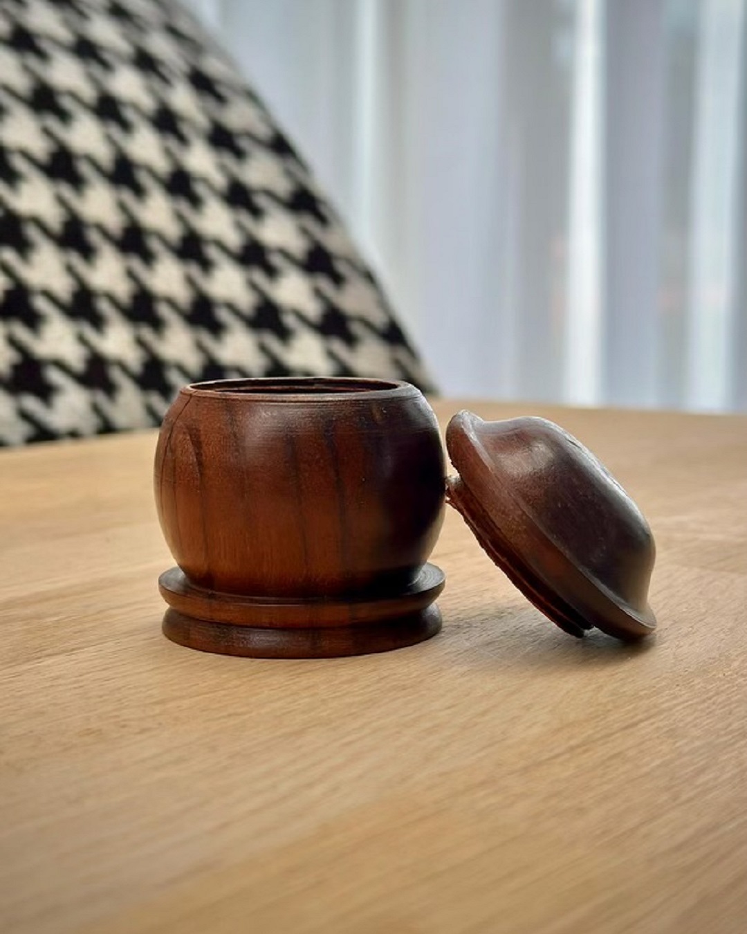 Wooden container hand woven on table