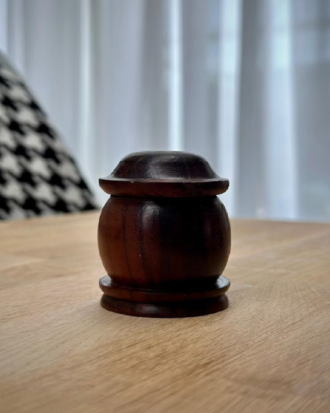 Wooden container hand woven on table