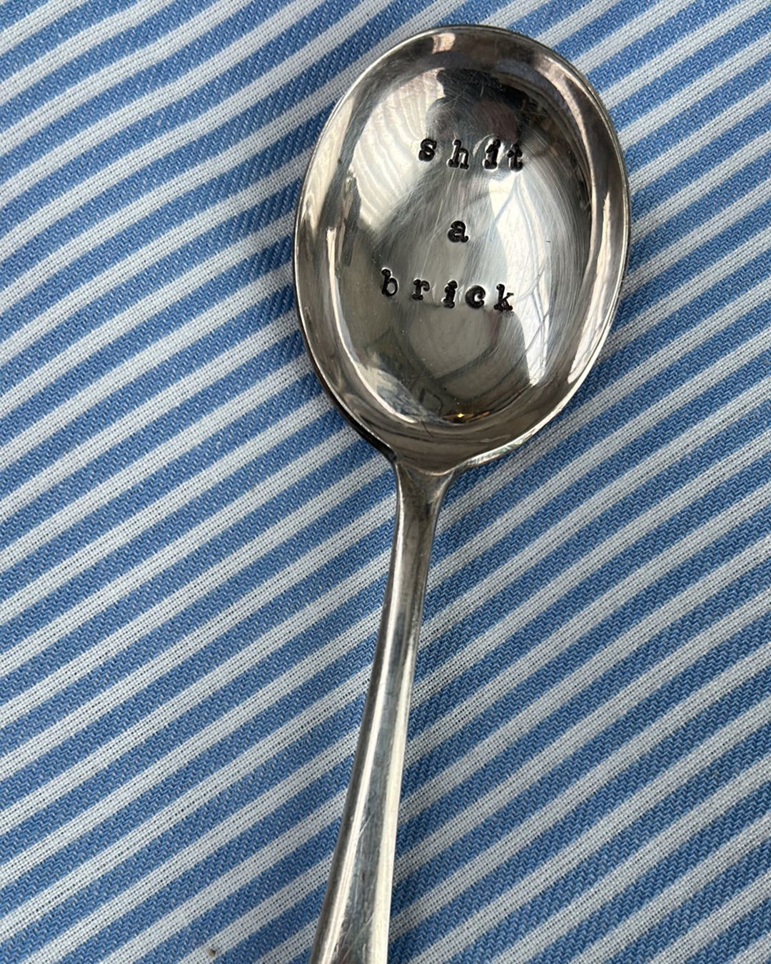 Silver stamped spoon shit a brick